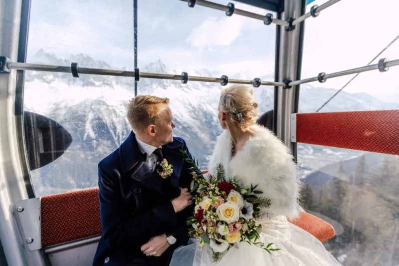 couple in the ski lift to altitude in Chamonix Mont Blanc